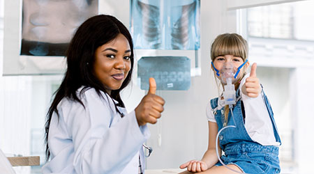 girl with a thumbs up